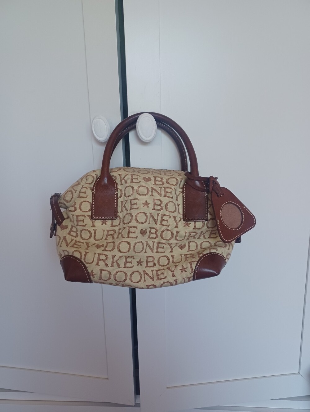 Dooney and Bourke brown and cream canvas
